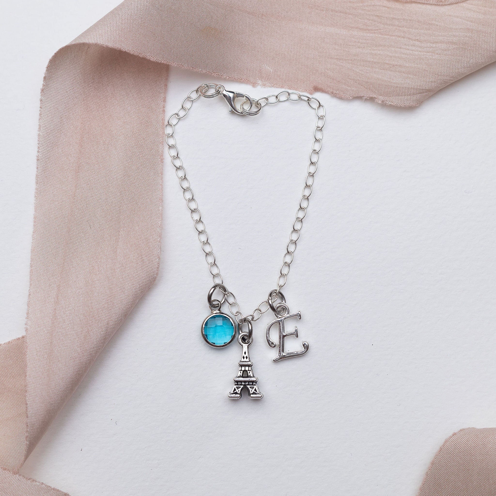 Paris bracelet, personalised gifts, Eiffel tower jewellery, birthstone initial charm, France surprise trip reveal, French theme accessory