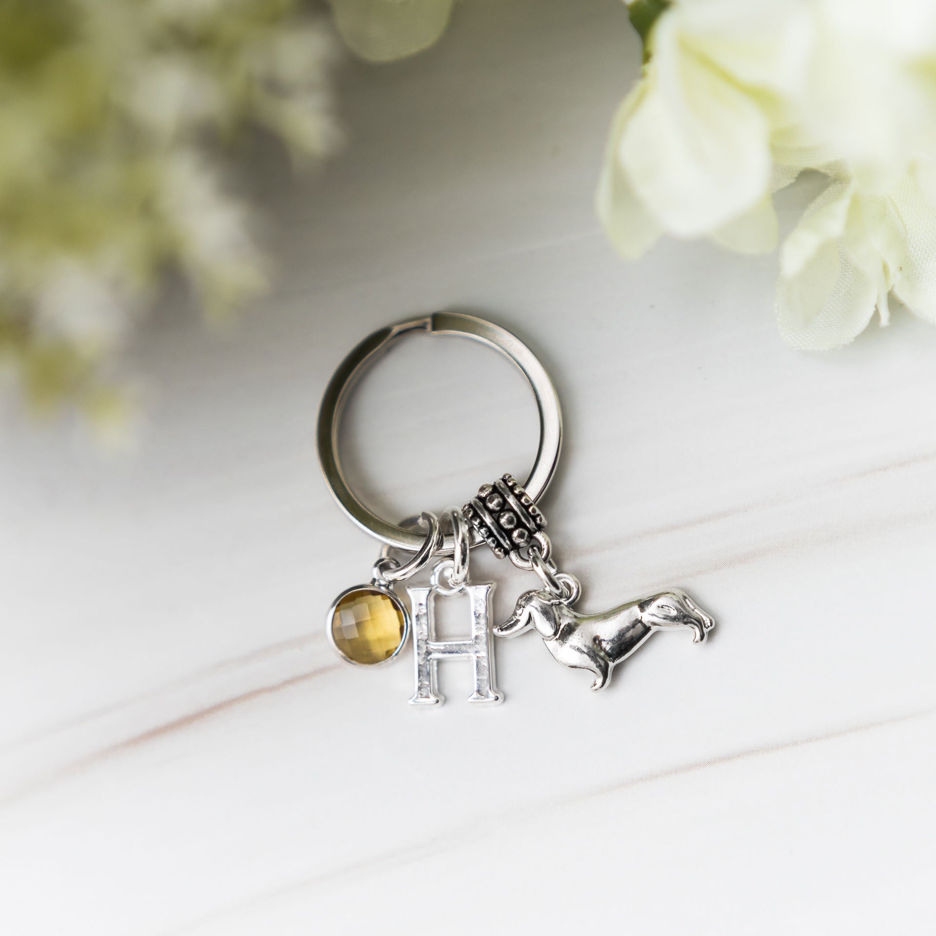 Personalised dachshund keyring with silver sausage dog charm, birthstone, and engraved initial